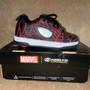 Never used Marvel Heelys.  Youth size 2.  Little kids.
